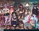 A group of women dressed up in costumes posing for a picture.