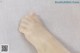 a close up of a person's foot on a bed
